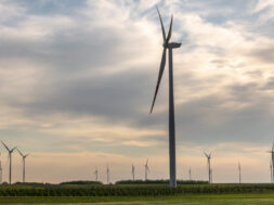 Wind Turbine In Wheat Field In Sunset. Sustainable Energy. Susta